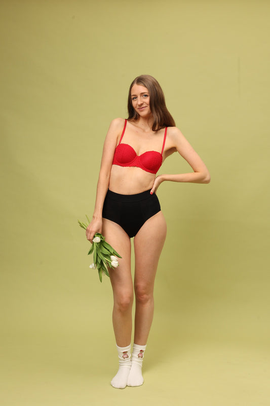 Full body front view of Cherrystain black hiphugger period underwear for medium flow