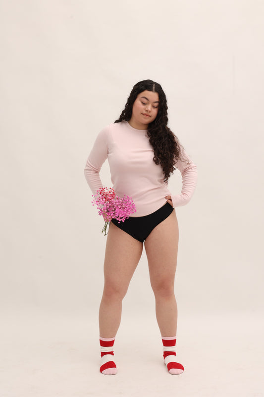 Full body front view of Cherrystain black seamless bikini designed for medium flow periods