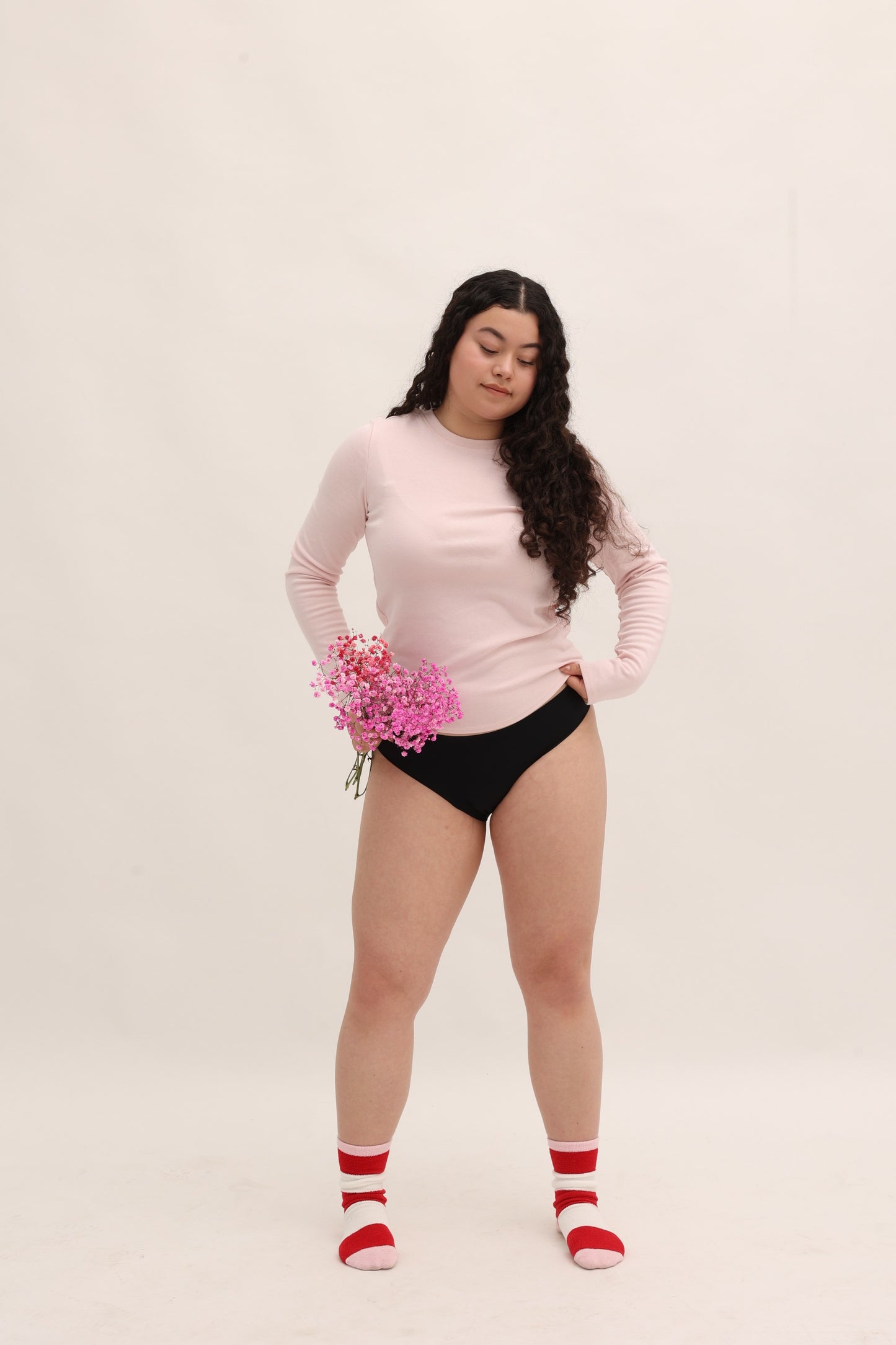 Full body front view of Cherrystain black seamless bikini designed for medium flow periods