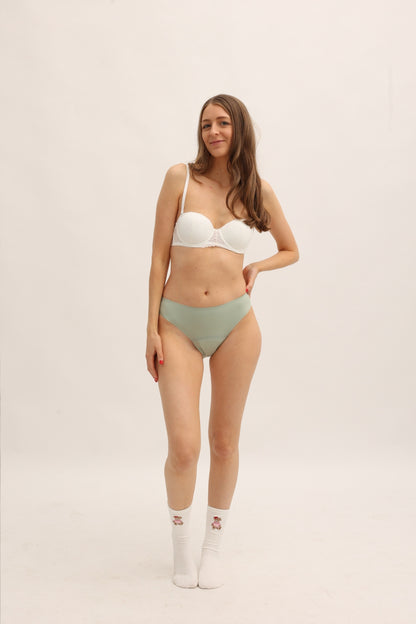 Full body front view of Cherrystain green seamless bikini designed for medium flow periods